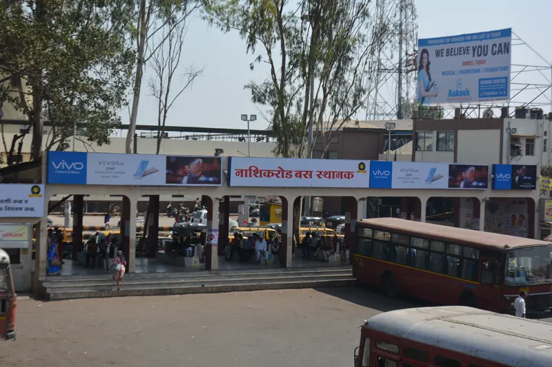 Row of advertising display boards along a city bus stand