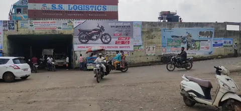 Outdoor wall advertising boards at a busy roadside location