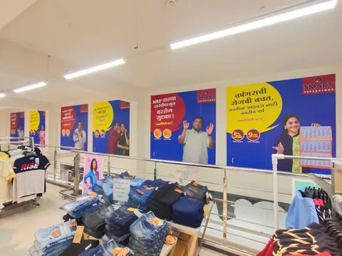 Printed promotional posters along the walls of a retail store